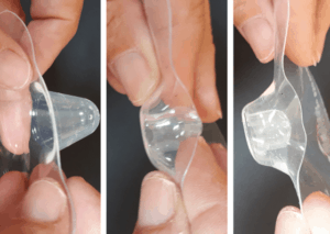 3 photos showing stages of turning a nipple shield inside out to place on nipple